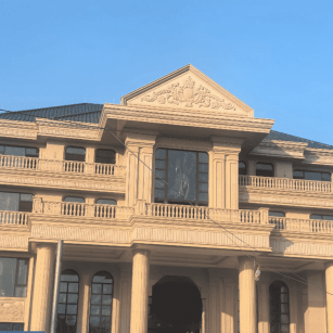 鹤岗黄金麻别墅外墙干挂石材效果示例